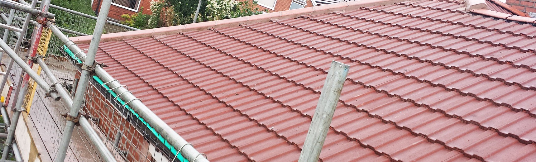 Roofing tiles being fitted